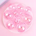 Detailed view of iridescent pink holographic balls for cake decoration and party ornament - Set of 12 / Pink