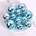 Close-up of blue mirror disco ball ornaments in a plate for party cake decoration - Set of 12 / Light Blue
