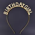 Detailed view of a golden metal "BIRTHDAY GIRL" headband with sparkling rhinestones. - Metal Headband / Gold