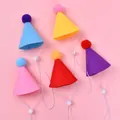 Detail view of five colorful felt party hats with pom-poms and straps for pet birthdays - Multicolor Non-woven Hats 5-Pack