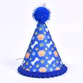 Close-up of a sparkling blue pet party hat featuring paw prints and bone patterns for dogs - Sapphire Blue