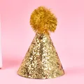 Close-up of golden glitter pet party hat with fluffy pom-pom detail for birthdays - Thick Glitter Pompom / Gold