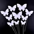 Close-up of elegant white butterfly cake toppers in various sizes for party decor. - 10 Pieces / White
