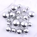 Close-up of 20pcs silver foam ball cake toppers in various sizes for baking decor - 20 Pieces Set / Silver