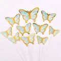 Close-up of gold and light blue butterfly cake toppers for birthday party decoration - 10 Pieces Set / Blue