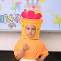 Close-up of a child wearing a creative yellow gift box shaped party headgear prop - Yellow Gift Box