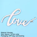 Macro view of minimalist wooden 'Love' script cake topper for birthday decorations - Wooden Love Letter / 14x8cm