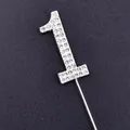 Close-up of sparkly silver rhinestone number 1 cake topper birthday decoration - Number 1 / Silver