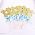 Detailed view of 6 glittery gold onesie-shaped cake toppers with blue bows. - Blue Bow (Onesie Question Mark) / 6Pcs/Set