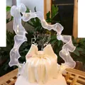 Close-up detail of elegant white glowing LED ribbon and Happy Birthday cake topper - Glowing Ribbon Set / White