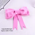 Close-up detail of a large double-layered pink EVA foam bow cake topper decoration - Double-Layer Large Bow / Pink