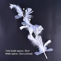 Elegant white feather cake topper with delicate pearls and gold wire, 35cm long. - Crystal Feather