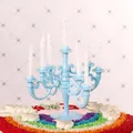 Detail view of light blue vintage plastic candelabra cake topper with white candles. - Blue (With Candles)