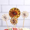 Set of 4 gold and white paper fan cake toppers with dots and stripes for party decor. - 4Pcs Set / Gold