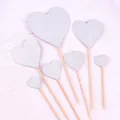 Detail of six silver glitter heart cake toppers in various sizes for party decoration - Heart Shape / Plastic Stick Style / Silver Glitter