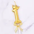 Detailed view of a golden number 1 birthday candle with a crown and mesh bow tie - Crown Number 1