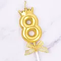 Elegant golden number 8 birthday candle featuring a crown top and a glittery gold bow - Crown Number 8