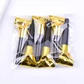 Six-pack of shiny gold and black party blowout whistles in clear plastic packaging - 6.5cm Gold 6 Pieces