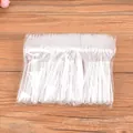 Pack of 100 disposable transparent plastic forks for desserts, cakes, and fruits - 100 Pieces Pack / Clear