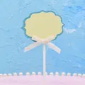 DIY yellow writable cake topper with blue glitter border and white bow ribbon decoration - Beige Blank Style