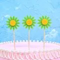 Set of three green and yellow sunflower cake toppers displayed on a pink pearl cake - 3 Piece Set / Green