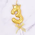 Elegant golden number 3 birthday candle featuring a crown top and a glittery gold bow - Crown Number 3