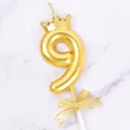 Golden number 9 birthday candle featuring a mini crown and mesh bow for cake topper - Crown Number 9