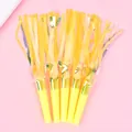 Pack of 5 yellow and gold metallic tinsel party blowouts on pink background - Double Layer Iridescent Yellow 5 Pieces