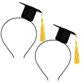 Detail of two mini black graduation cap headbands with bright yellow tassels for party. - Gold Yellow Tassel
