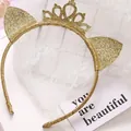Elegant golden glitter cat ear headband featuring a central crown for party celebrations - Headband Style / Gold