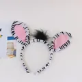Close-up of zebra pattern animal headband with plush ears and black faux fur detail - Zebra Headband