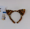 Soft plush tiger-ear headband accessory for cute animal cosplay and party costumes. - Tiger Print Headband