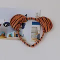Detailed macro view of the plush texture and stripe pattern on the tiger ear headband. - Tiger Headband