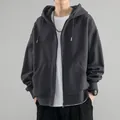 Close-up detail of a men's dark grey zip-up hooded sweatshirt with fleece lining - Dark Gray