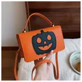 Vibrant orange Halloween pumpkin crossbody handbag for women in a cozy home setting - Orange