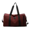 Spacious burgundy travel and gym bag featuring black handles and wet-dry separation - 45x22x26cm / Burgundy