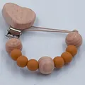 Handmade beech wood heart and earthy yellow silicone bead pacifier clip for baby soothing - Light Coffee