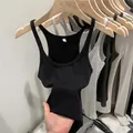 Minimalist black ribbed knit tank top featuring a slim fit and elastic summer style - Black