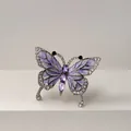 Macro view of a vintage butterfly brooch with purple enamel and sparkling crystals - Purple Butterfly Brooch