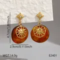 Boucles d'oreilles vintage en résine ambre avec soleil, étoiles et détails en strass. - Pendentif Rond Masque Solaire Vintage (BJGE2401)