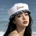 Stylish white sailor hat with denim ruffle and gold Love brooch for women - Letter Style / White