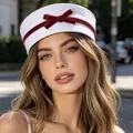 Stylish white sailor hat for women featuring a classic decorative red velvet bow - Vintage Sailor Hat / White (Red Bow)