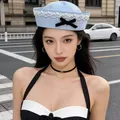 Stylish light blue sailor hat for women featuring white lace trim and black bow - Light Blue with Lace and Bow