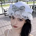 Elegant white sailor hat for women featuring a sequin bow and pearl lace trim detail - Rhinestone Bowknot Style / White