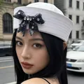 Stylish white sailor navy hat for women featuring a sparkling rhinestone denim bowtie accessory - Black Bow Trim Style / White
