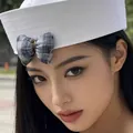 Stylish elegant white sailor hat for women featuring a blue checkered bow decoration. - Korean Style Sailor Hat Style / White