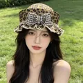 Stylish women's leopard print sailor hat featuring a pearl encrusted bow decoration - Retro Navy Beret / Leopard Print