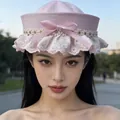 Elegant pink sailor hat with white lace trim and bow decoration worn by female model - Lace Trim Floral Pink Bow Sailor Hat / Pink