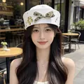 Elegant white sailor hat for women featuring a camouflage bow and pearl decorations - White Bow With Rhinestones
