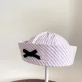 Fashionable women's pink and white striped sailor hat featuring a decorative black bow knot - Pink Stripe